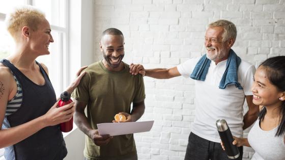 Group of employees talking after working out